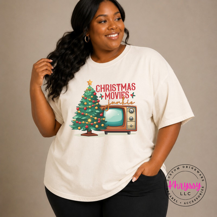 Model wearing the Christmas movie junkie tee in Ivory.