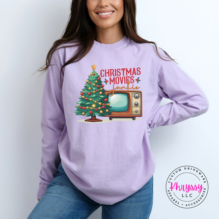 Close up of the Christmas movie junkie art on an Orchid tee.