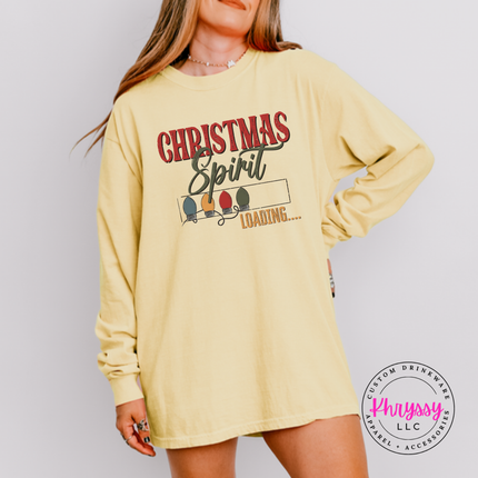Model wearing the Christmas Spirit Loading long sleeve tee in Butter.
