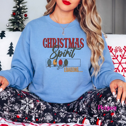 Model wearing the Christmas Spirit Loading crewneck sweatshirt in Carolina Blue.
