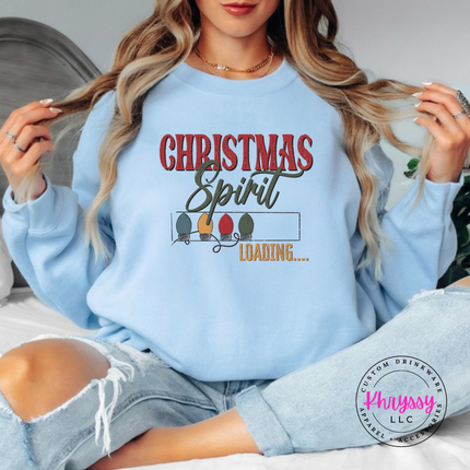 Flat lay of the Christmas Spirit Loading Christmas crewneck sweatshirt in Light Blue.