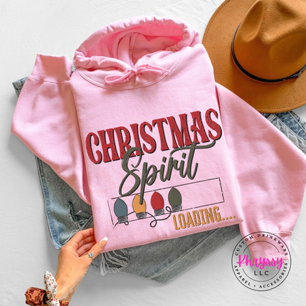 Flat lay of the Christmas Spirit Loading Christmas hoodie in Light Pink.