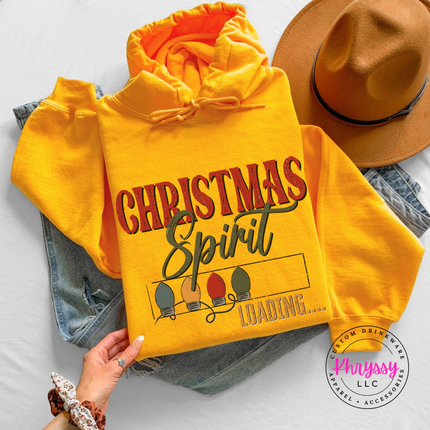Close up of the Christmas Spirit Loading art on a Gold hoodie.