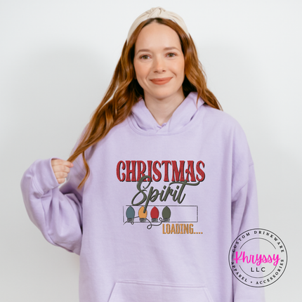 Model wearing the Christmas Spirit Loading hoodie in Orchid.