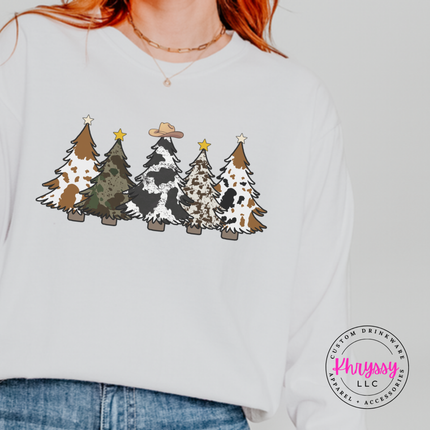 Flat lay of the cow print trees Christmas tee in White.