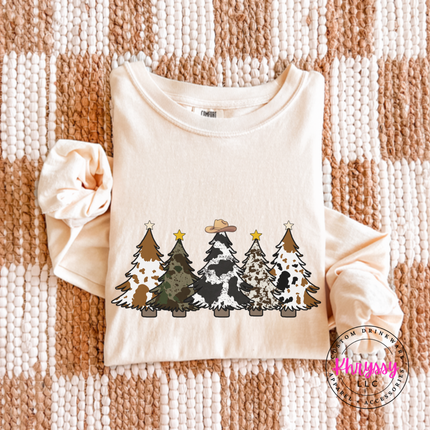 Model wearing the cow print trees long sleeve tee in Ivory.