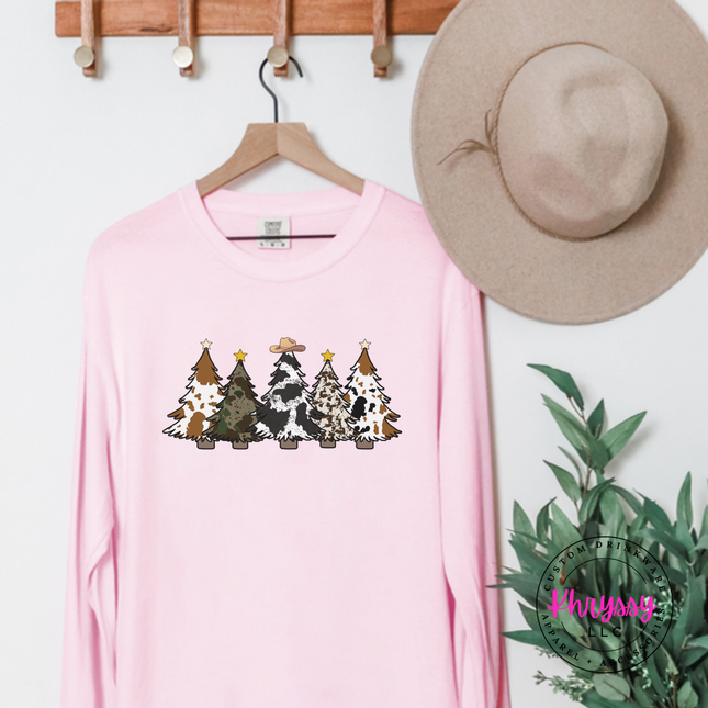 Blossom long sleeve tee featuring five cow print and leopard Christmas trees.