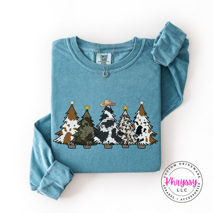 Ice Blue long sleeve tee featuring five cow print and leopard Christmas trees.