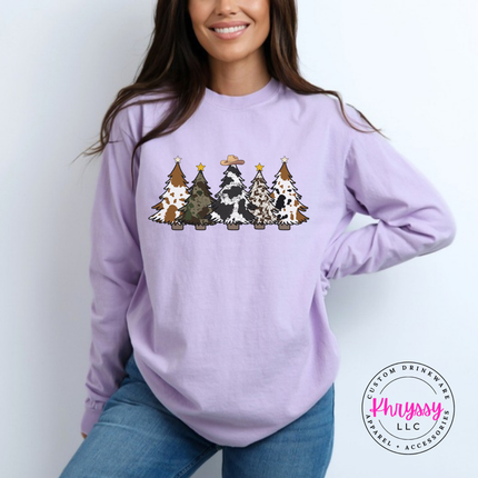Close up of the cow print trees art on an Orchid long sleeve tee.