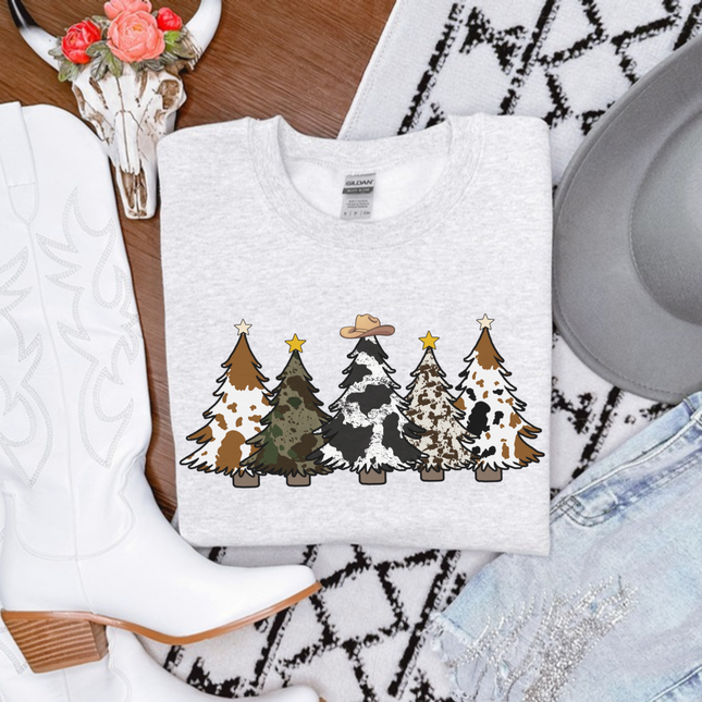 Ash crewneck sweatshirt featuring five cow print and leopard Christmas trees.