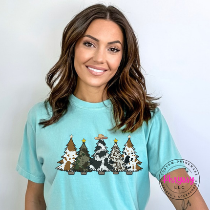 Close up of the cow print trees art on a Chalky Mint tee.