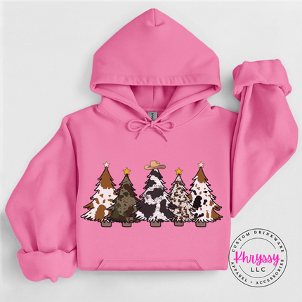 Model wearing the cow print trees hoodie in Azalea.