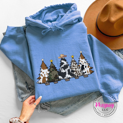 Close up of the cow print trees art on a Carolina Blue hoodie.