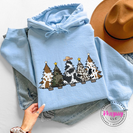Flat lay of the cow print trees Christmas hoodie in Light Blue.