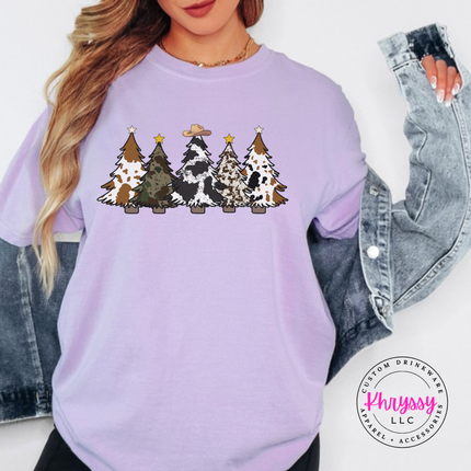 Close up of the cow print trees art on an Orchid tee.
