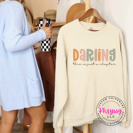 Sand crewneck sweatshirt showing a gentle pastel hope and encouragement design