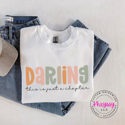 White crewneck sweatshirt with Darling lettering and cursive subtext