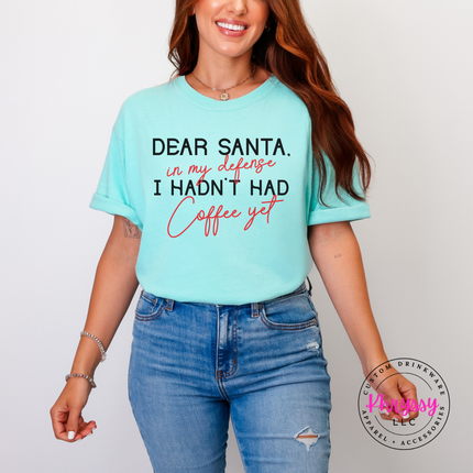 Woman wearing the Dear Santa coffee tee in Chalky Mint.