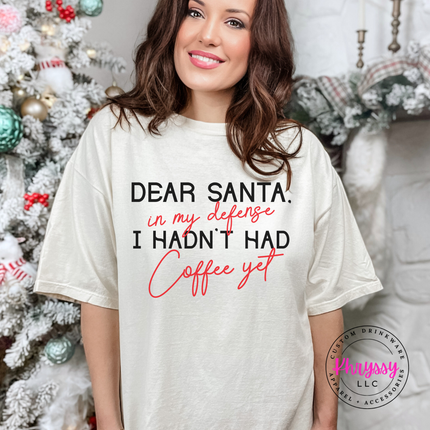 Woman wearing the Dear Santa coffee tee in Ivory.