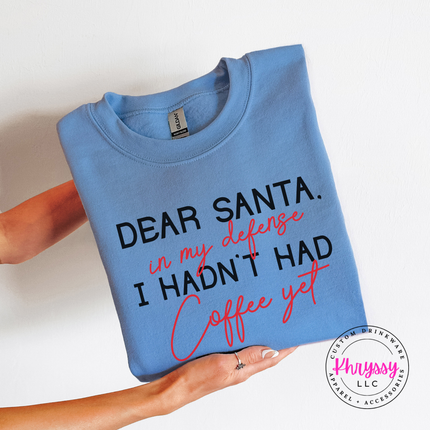 Funny Dear Santa in my defense coffee design on a Carolina Blue crewneck sweatshirt.