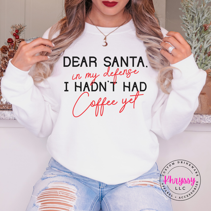 Close up of the Dear Santa coffee quote on a White crewneck sweatshirt.