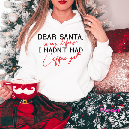 Close up of the Dear Santa coffee quote on a White hoodie.