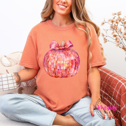 Terracotta tee with a pink mosaic disco pumpkin graphic print.