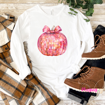 white tee styled with jeans, featuring a pink mosaic pumpkin print.