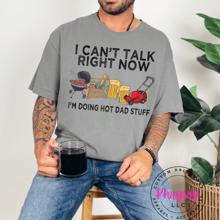 Grill, toolbox, beer mugs, and mower with “Doing Hot Dad Stuff” slogan