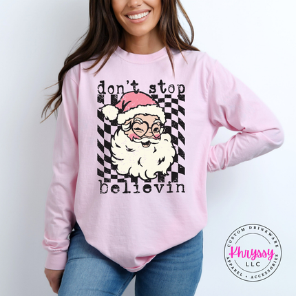 Blossom long sleeve tee featuring a winking Santa over a checkered circle.