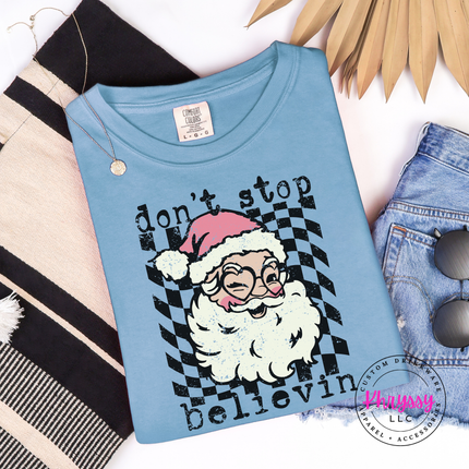 Ice Blue long sleeve tee featuring a winking Santa over a checkered circle.