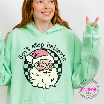 Flat lay of the retro believing Santa Christmas hoodie in Mint Green.