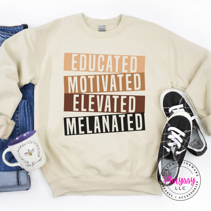 sand heavyweight crewneck with bold gold brown black stacked bar Educated Motivated Elevated Melanated statement.