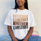 white relaxed tee showing bold stacked bar Educated Motivated Elevated Melanated typography.