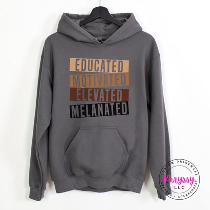 Charcoal Gildan hoodie printed with bold gold brown and black Educated Motivated Elevated Melanated design.