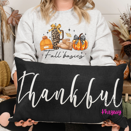 Woman wearing an Ash crewneck sweatshirt with a Fall Basics lifestyle graphic.