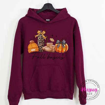 Woman wearing an maroon heavyweight hoodie with a Fall Basics lifestyle graphic.