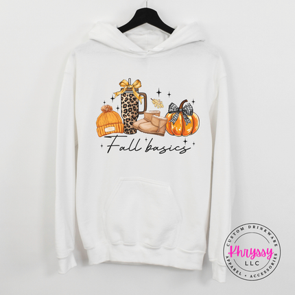 White hoodie with kangaroo pocket showing a leopard tumbler and pumpkin graphic.