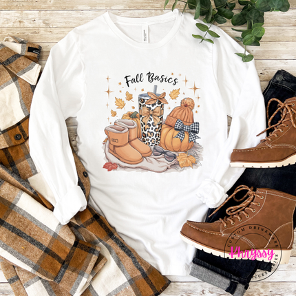 White tee styled with jeans, featuring a bow-topped pumpkin graphic.