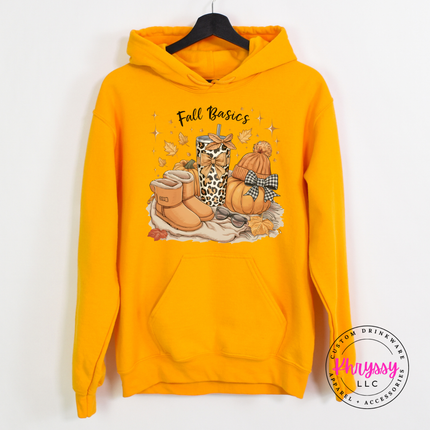 Gold colored hoodie featuring a beanie, boots, and a bow-topped pumpkin.