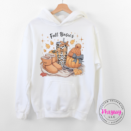 white hoodie featuring cozy boots and a bow-topped pumpkin design.