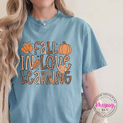 Ice Blue tee with the Fall in love with learning teacher graphic