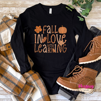 Black tee with a playful Fall In Love With Learning design.