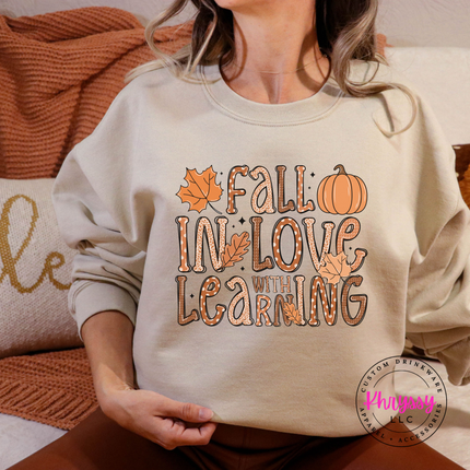 Sand colored crewneck sweatshirt featuring a pumpkin and leaves design.