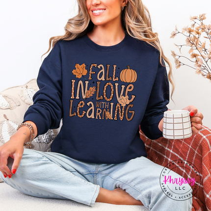 Navy crewneck sweatshirt featuring dotted bubble letters and maple leaves.