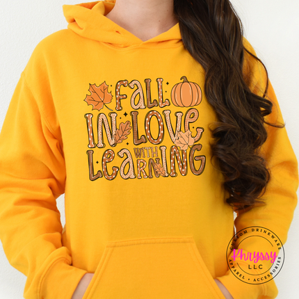 Gold hoodie with the autumn teacher lettering graphic