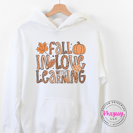 White pullover hoodie with a playful fall teacher illustration.
