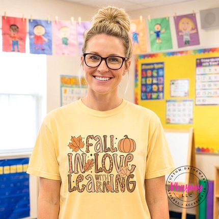 Butter tee with a hand-illustrated Fall In Love With Learning print.