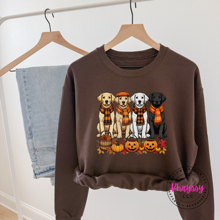 Cozy Dark Chocolate fleece crewneck featuring four scarf-wearing puppies and pumpkins.