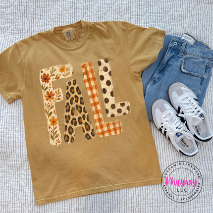 Mustard pigment-dyed tee with rust floral and leopard print FALL graphic.